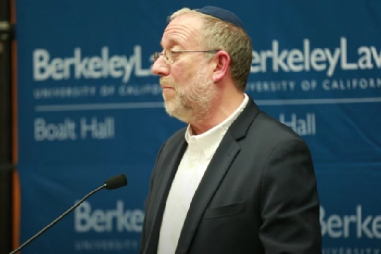 Rabbi man speaking on podium