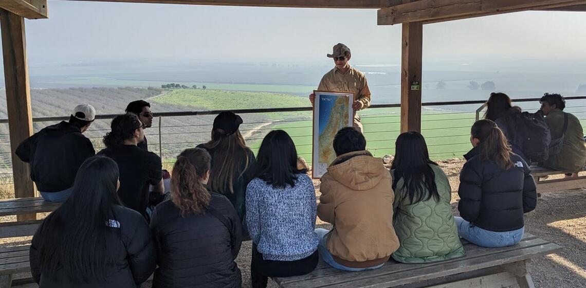 students learning from a tour guide
